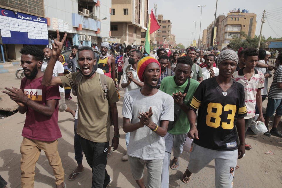 Anti-military protesters march on Friday, July 1, 2022 in Khartoum, Sudan, a day after nine people were killed in demonstrations against the country’s ruling generals. (AP Photo/Marwan Ali)