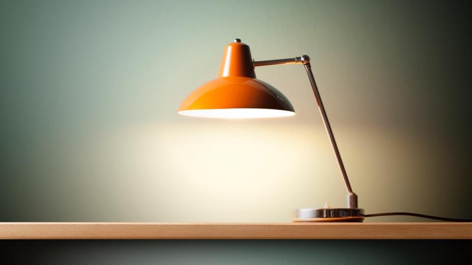 An illuminated light on a desk to help prevent an afternoon slump