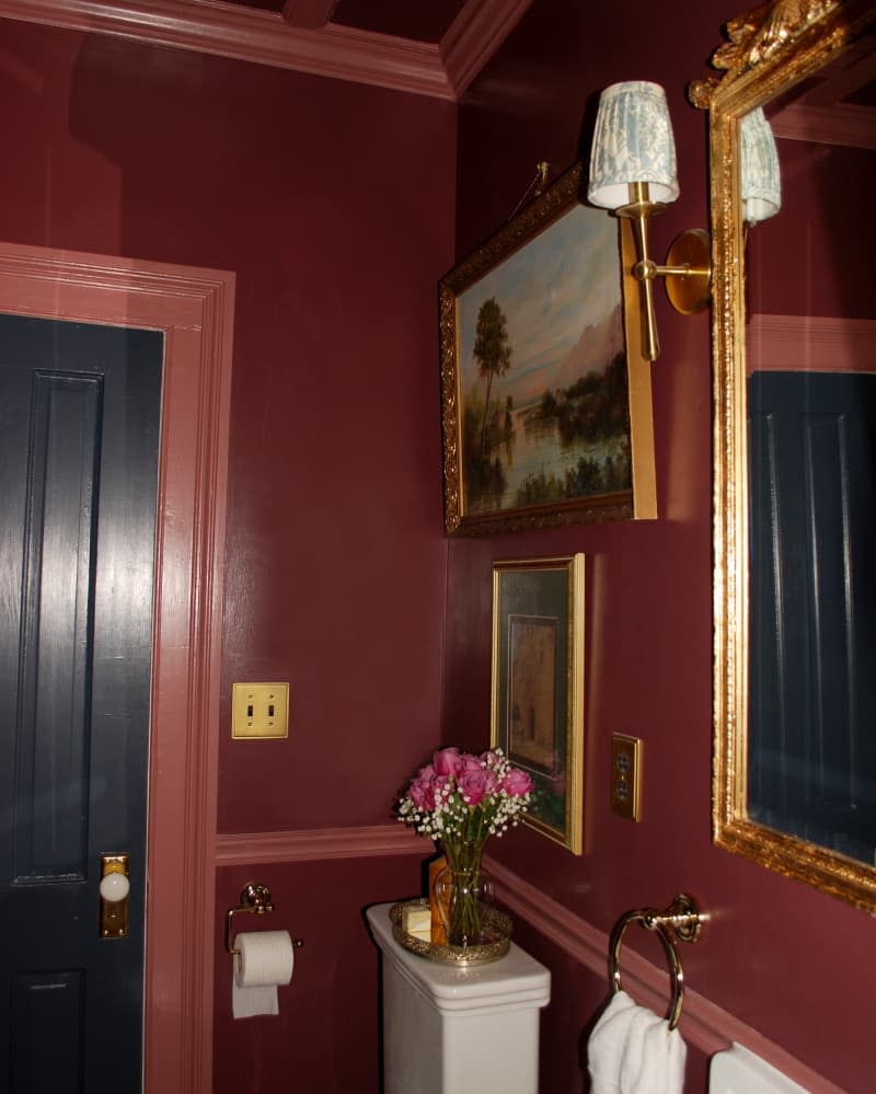 Newly renovated bathroom with maroon paint.