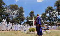 Faithful participate in a holy procession after celebrating a mass, amid concerns about the spread of coronavirus disease (COVID-19) at the St. Joanes, Legio Maria African Mission Church within Fort Jesus in Kibera slums of Nairobi