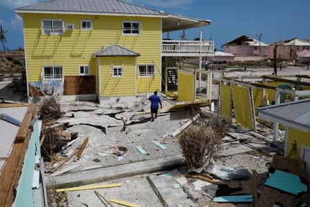 A man walks among debris after Hurricane Dorian hit the Abaco Islands in Treasure Cay