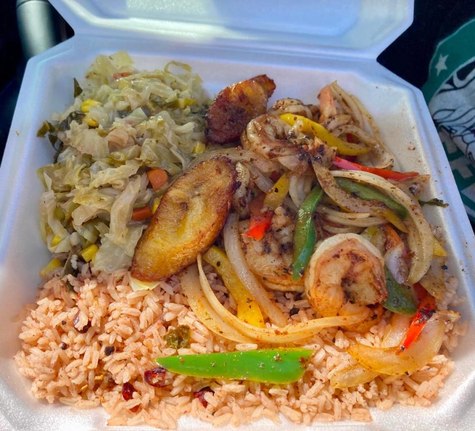 Grilled shrimp with cabbage and rice and peas from Crooklyn New York Caribbean Cuisine.