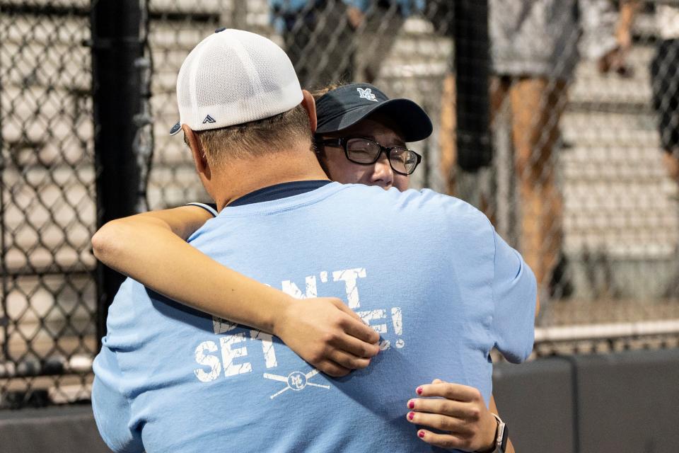 Morris Catholic takes on St. Joseph Academy in the Non-Public B softball state finals at Kean University in Union, NJ on Friday, June 9, 2023. Morris Catholic coach Nick DeGennaro consoles MC #31 Hannah Streicher after they lost to SJA 7-1. 