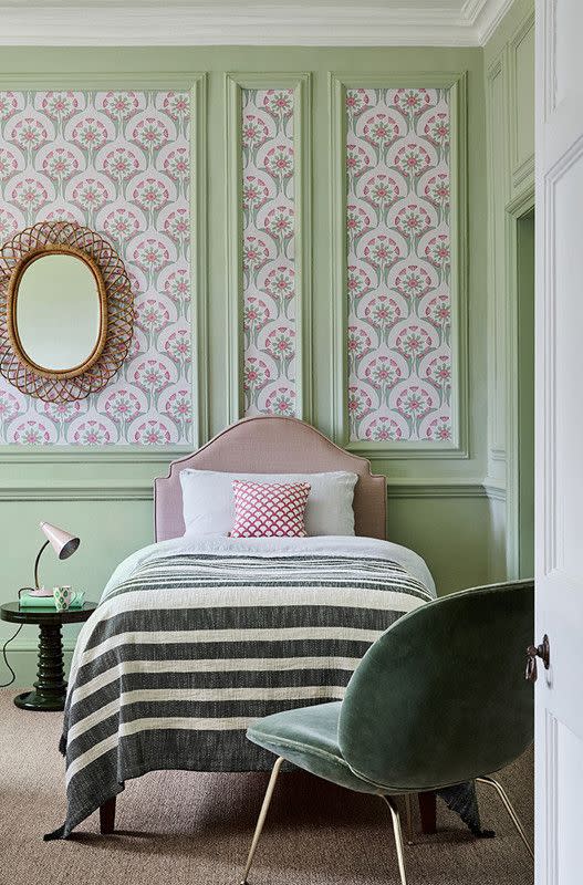 <p>If you have a bedroom with wall panelling, using wallpaper within the recesses is very effective at drawing the eye, and making the most of an already beautiful home feature. Choose a playful pattern like the Hencroft wallpaper shown here, that picks up the surrounding chalky greens and pretty pinks.</p><p>Pictured: <a href="https://www.littlegreene.com/catalog/product/view/id/41525/s/hencroft-pink-primula/category/43/" rel="nofollow noopener" target="_blank" data-ylk="slk:Hencroft Pink Primula at Little Greene" class="link ">Hencroft Pink Primula at Little Greene</a></p>