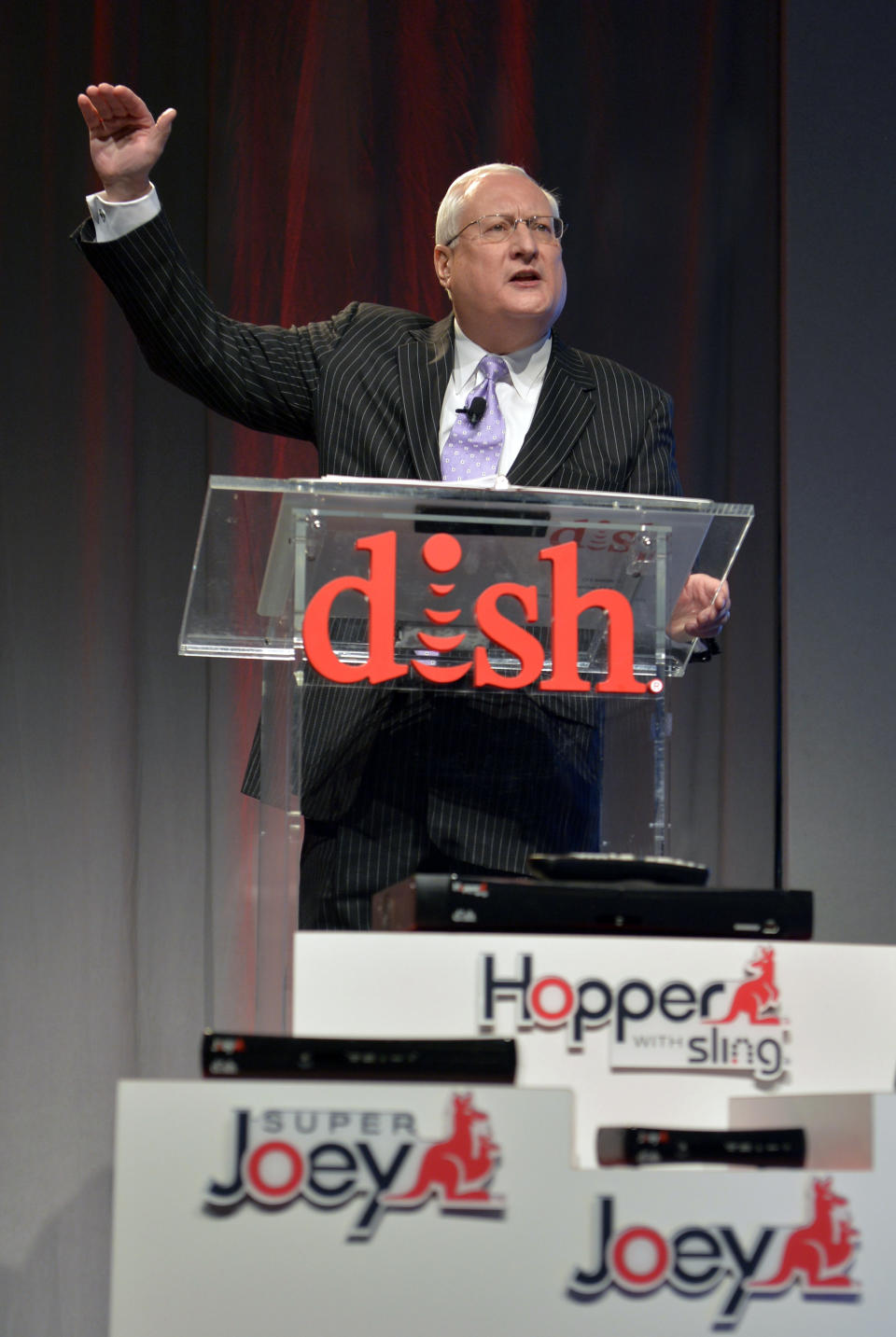 Dish president and CEO Joe Clayton talks to the media during the Dish news conference at the 2014 International Consumer Electronics Show Monday, Jan. 6, 2014, in Las Vegas. (AP Photo/Jack Dempsey)