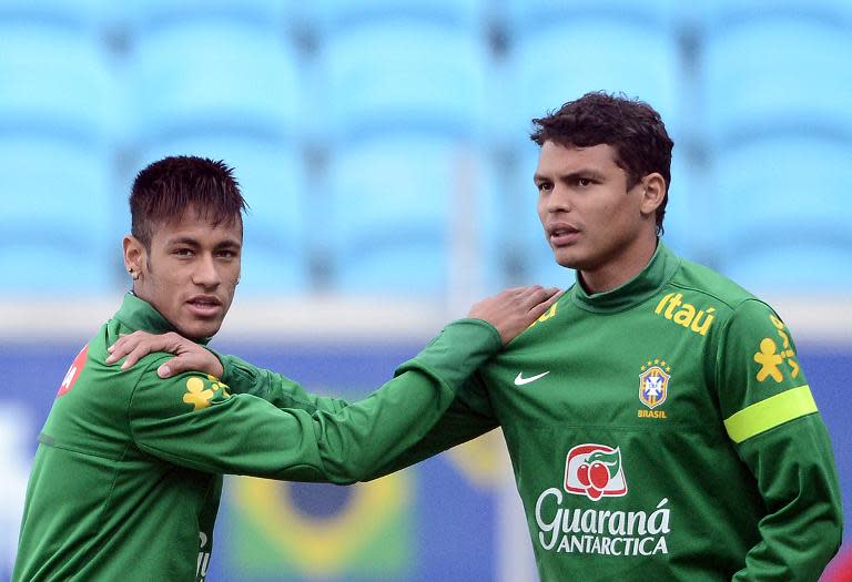 Brazil's forward Neymar (L) and defender Thiago Silva take part in a training session, on June 8, 2013 at the Arena Gremio Stadium in Porto Alegre