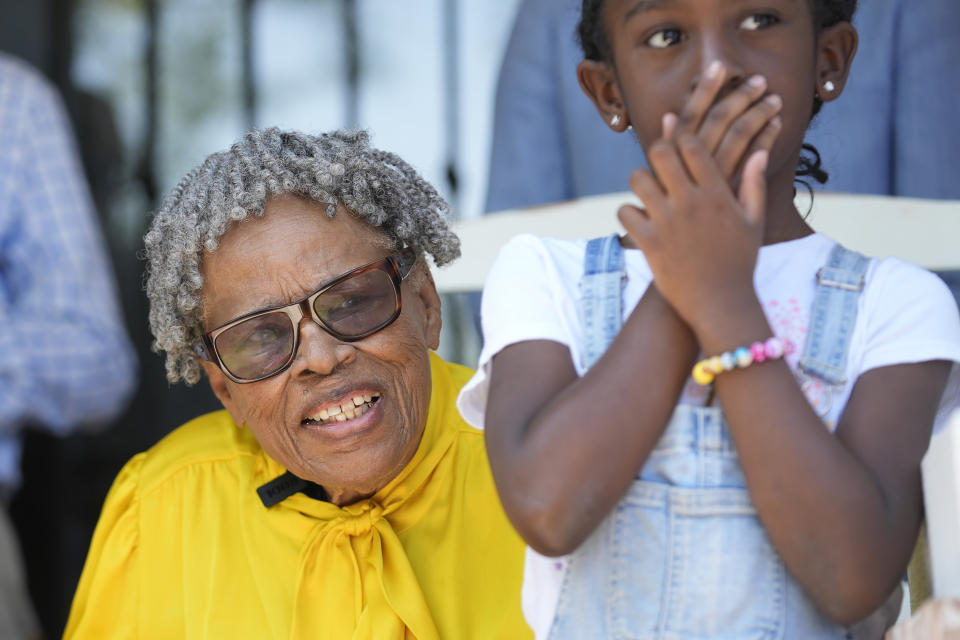 Opal Lee smiles while sitting on the porch of her new house in Fort Worth, Texas, Friday, June 14, 2024. Habitat for Humanity built Lee the home on the same lot where as a child a white mob destroyed her family's home driving them away. (AP Photo/LM Otero)