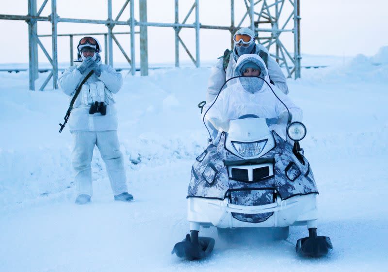 FILE PHOTO: Russian servicemen guard area at Nagurskoye military base in Alexandra Land on remote Arctic islands of Franz Josef Land