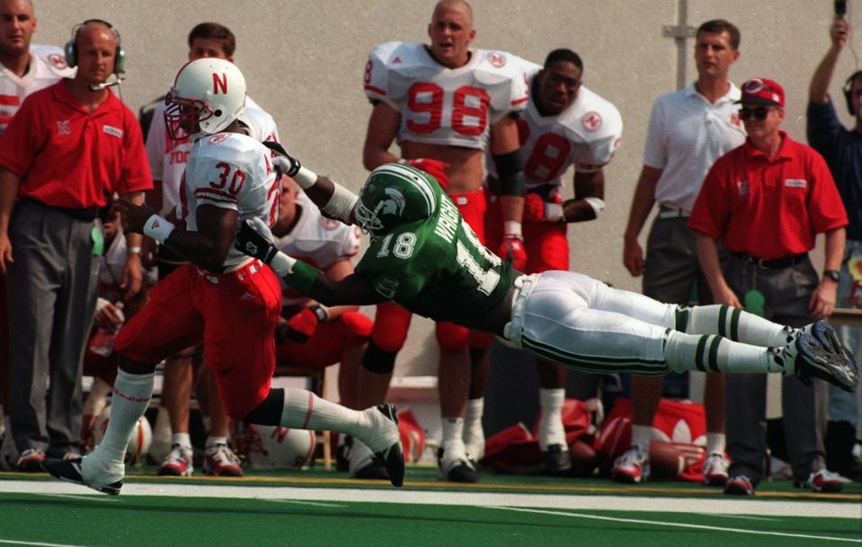 Nebraska third-string running back Ahman Green breaks away from MSU's Marvin Wright for a 57-yard touchdown run during the Cornhuskers' 50-10 win at Spartan Stadium in 1995. The '95 Huskers are arguably the greatest team in modern college football history.