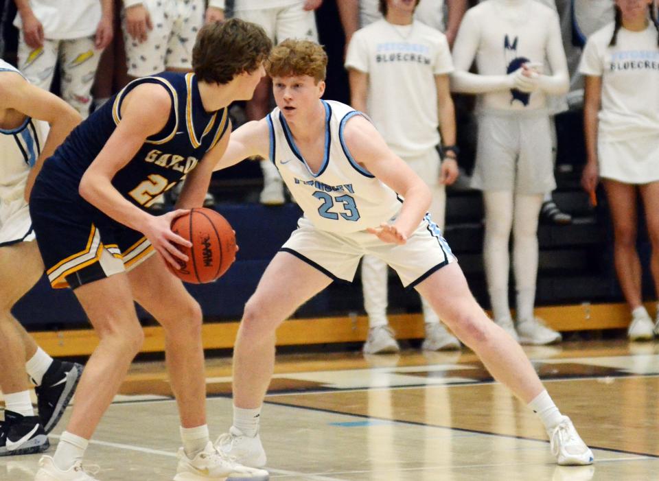 Petoskey's Lucas O'Donnell (23) guard's Gaylord's Luke Gelow during the second half of Thursday's game.