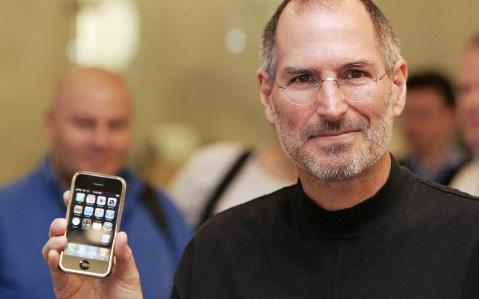 The late Apple boss Steve Jobs launched the first iPhone 10 years ago this month - AFP