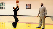 Roberts shoots some hoops with basketball legend Shaquille O’Neal on the court inside his Florida mansion.