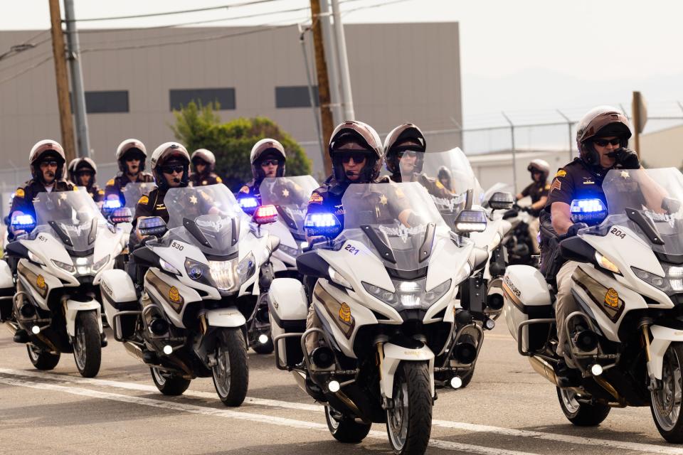 Utah highway patrol officers lead the presidential motorcade out of the Roland R. Wright Air National Guard Base in Salt Lake City on Wednesday, Aug. 9, 2023. | Megan Nielsen, Deseret News