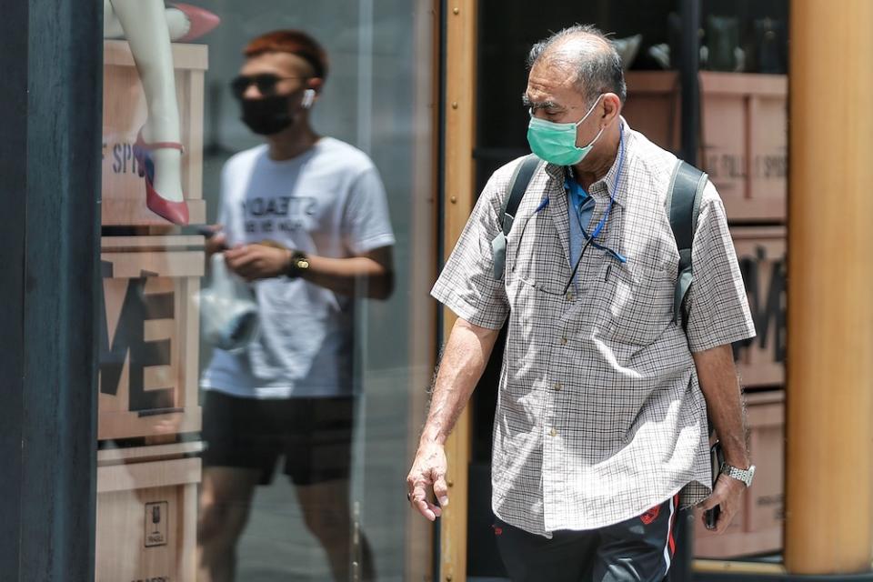 The World Health Organisation is standing by its position on surgical masks, saying wearing one by itself was not a preventive measure against Covid-19. — Picture by Ahmad Zamzahuri