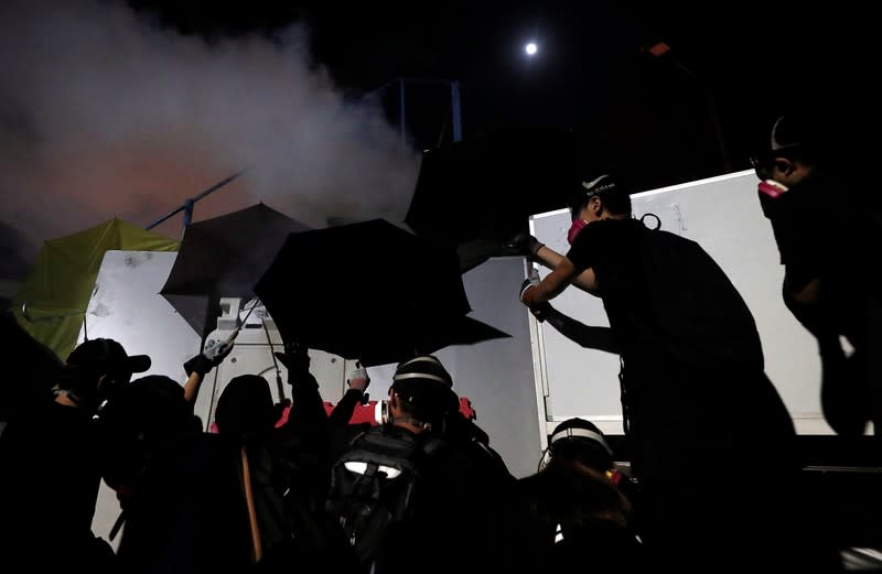 Protesters form a barricade during a standoff with riot police at the Chinese University of Hong Kong