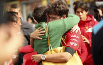 The mother of Anthoine Hubert embraces Ferrari driver Charles Leclerc of Monaco after a moment of silence for Formula 2 driver Anthoine Hubert at the Belgian Formula One Grand Prix circuit in Spa-Francorchamps, Belgium, Sunday, Sept. 1, 2019. The 22-year-old Hubert died following an estimated 160 mph (257 kph) collision on Lap 2 at the high-speed Spa-Francorchamps track, which earlier Saturday saw qualifying for Sunday's Formula One race. (AP Photo/Francisco Seco)