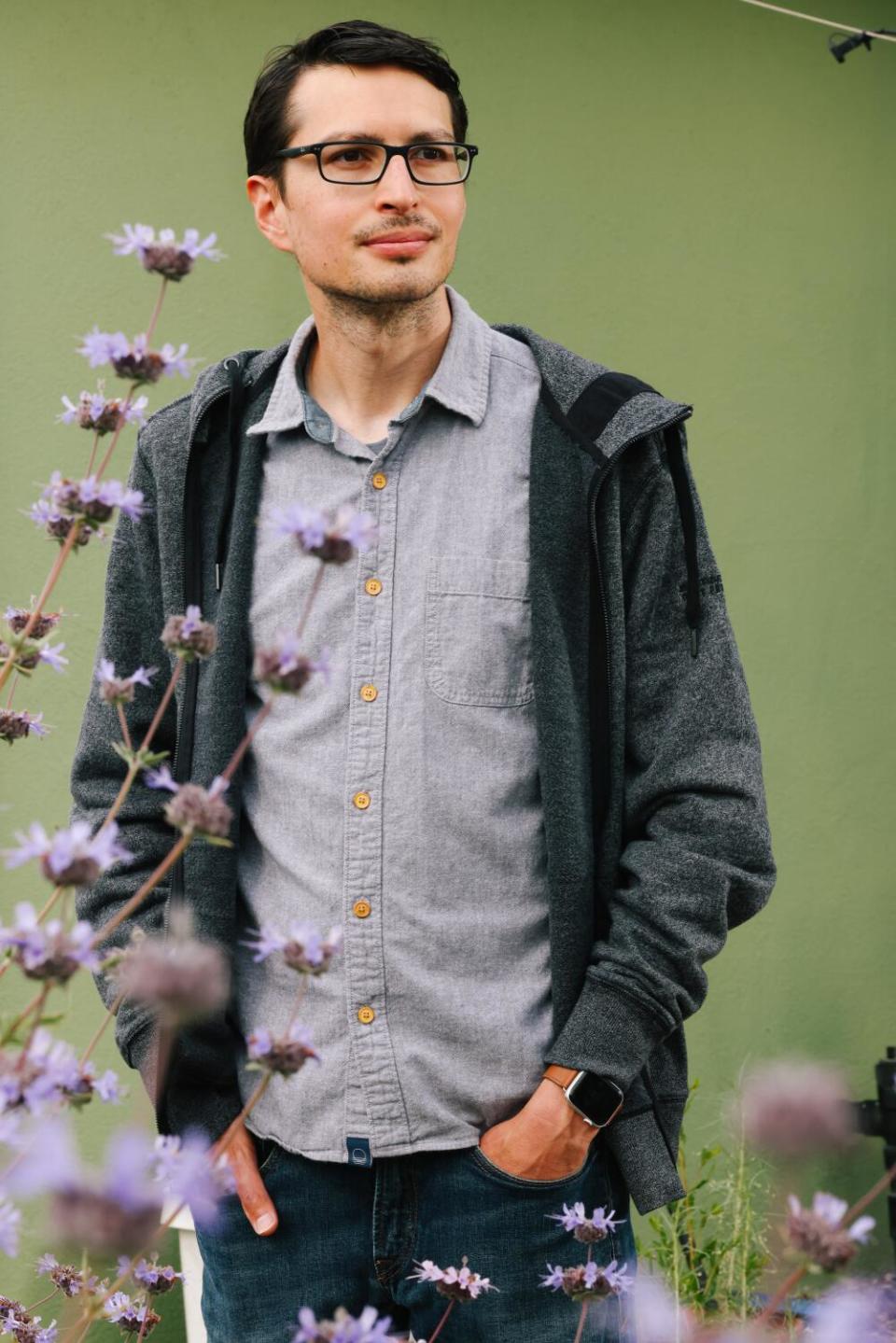 Brian Bautista poses for a portrait with Pozo Blue sage seen in the foreground.