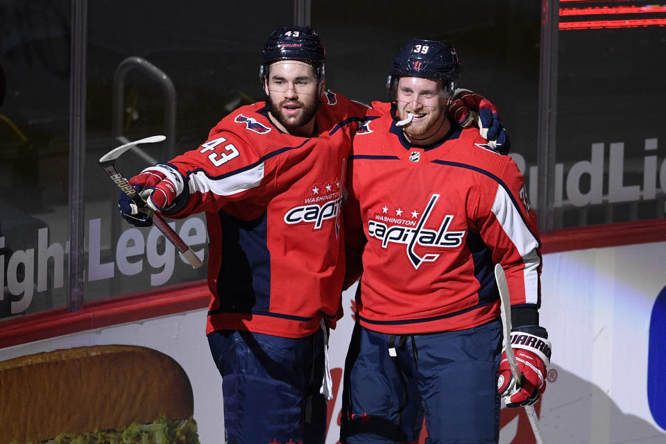 Washington Capitals right wing Tom Wilson (43) celebrates his goal against the Philadelphia Flyers with right wing Anthony Mantha (39) during the first period of an NHL hockey game Tuesday, April 13, 2021, in Washington. (AP Photo/Nick Wass)