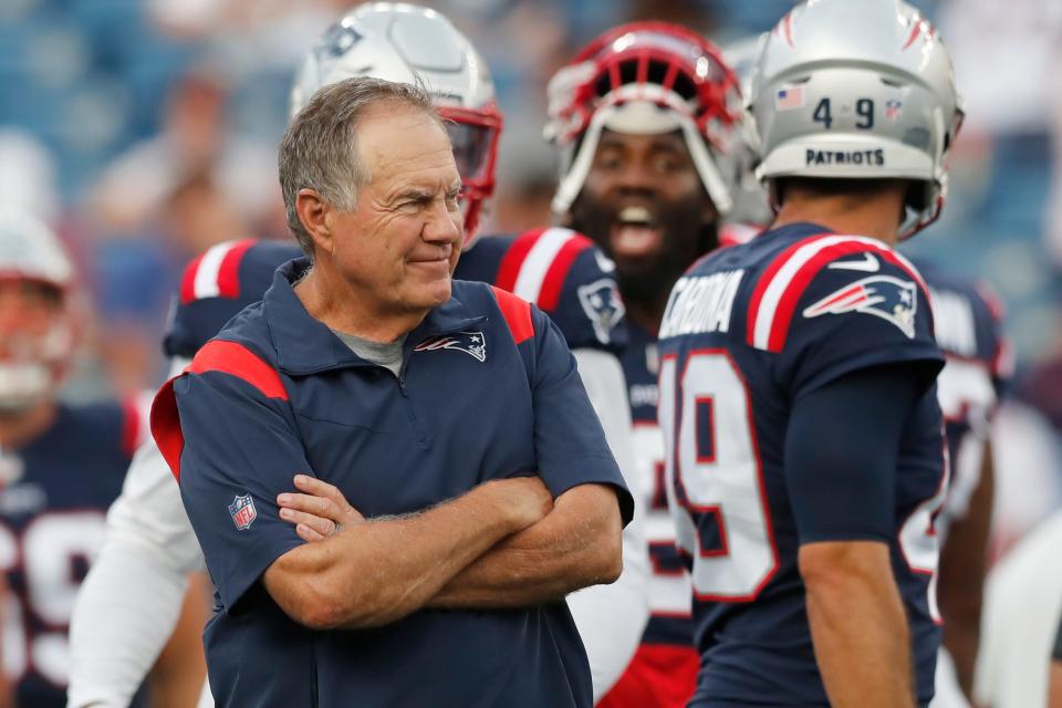 Patriots head coach Bill Belichick stands on the field prior to a preseason game against the New York Giants on Aug. 11. Just who Belichick will trust with calling the offensive plays this season remains a mystery.