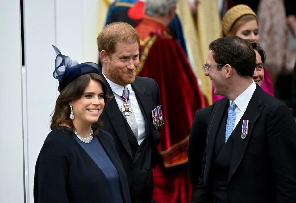 Britain's Prince Harry, Duke of Sussex, Princess Eugenie and her husband Jack Brooksbank leave Westminster Abbey following the coronation ceremony of Britain's King Charles and Queen Camilla, in London, Saturday, May 6, 2023. (Toby Melville, Pool via AP)