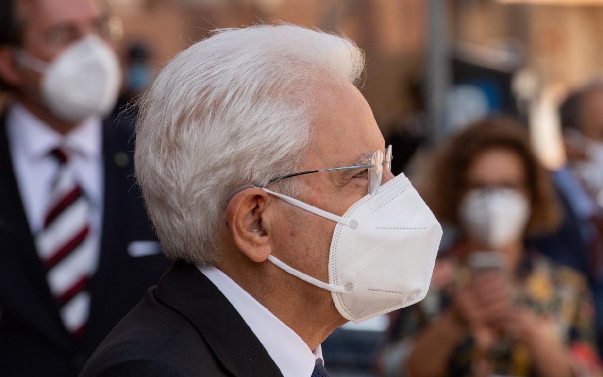 Italy's president Sergio Mattarella wears a mosk on a visit to a university - Getty Images