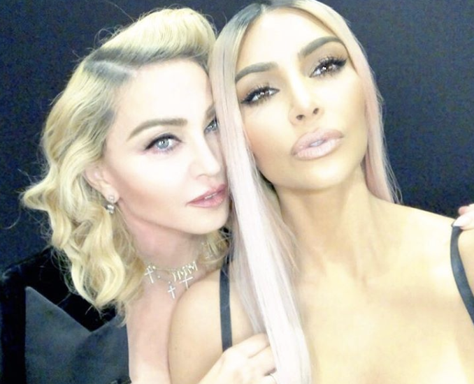 <p>The queen of social media would never let a photo opportunity with someone as rockstar-famous as Madonna go by. The moguls snapped this selfie after meeting up at a talk for a talk promoting their respective beauty lines: MDNA Skin and KKW Beauty. (Photo: <a rel="nofollow noopener" href="https://www.instagram.com/kimkardashian/" target="_blank" data-ylk="slk:Kim Kardashian via Instagram;elm:context_link;itc:0;sec:content-canvas" class="link ">Kim Kardashian via Instagram</a>) </p>