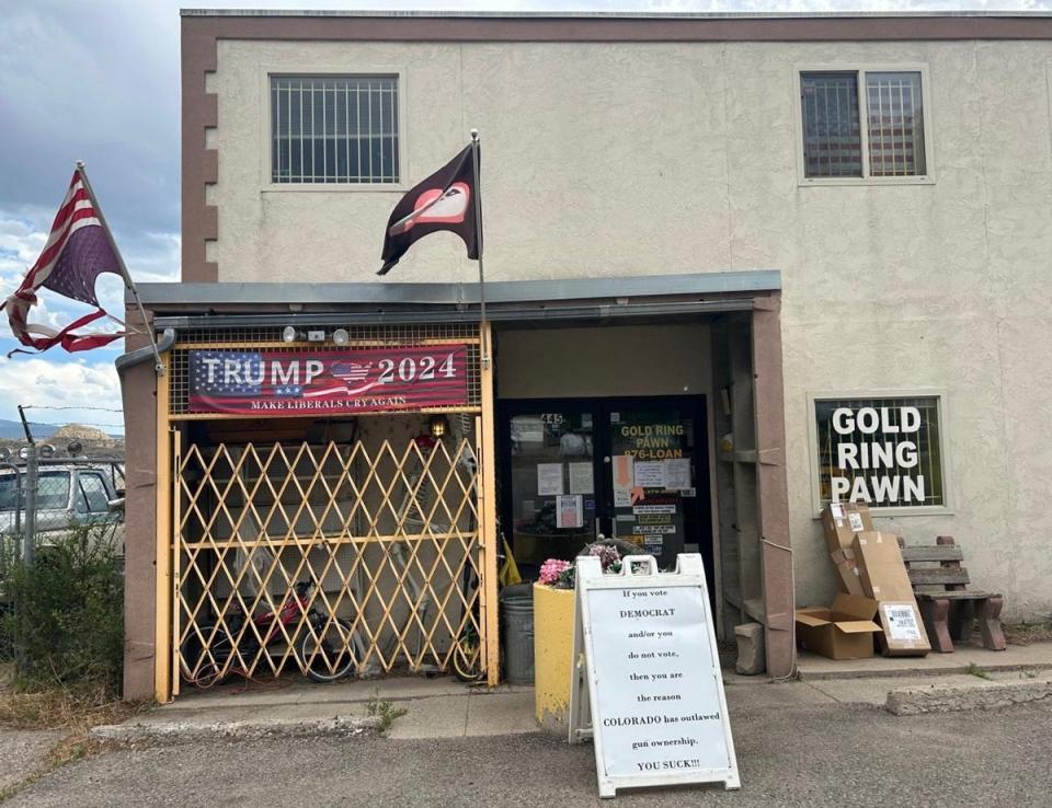 Outside of Garfield County Republican Doug Wight’s pawn shop in Stilt, Colorado sits a sign aimed at local Democrats and those who don’t vote (Sheila Flynn)