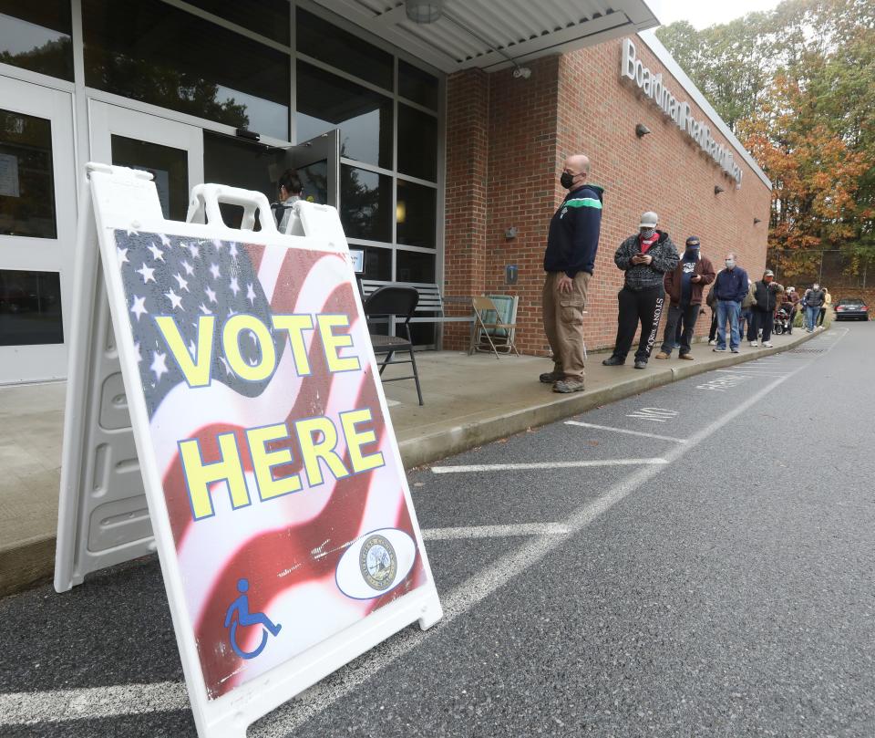 Voters line up outside the Boardman Road Branch Library in the Town of Poughkeepsie for early voting on October 28, 2020. 