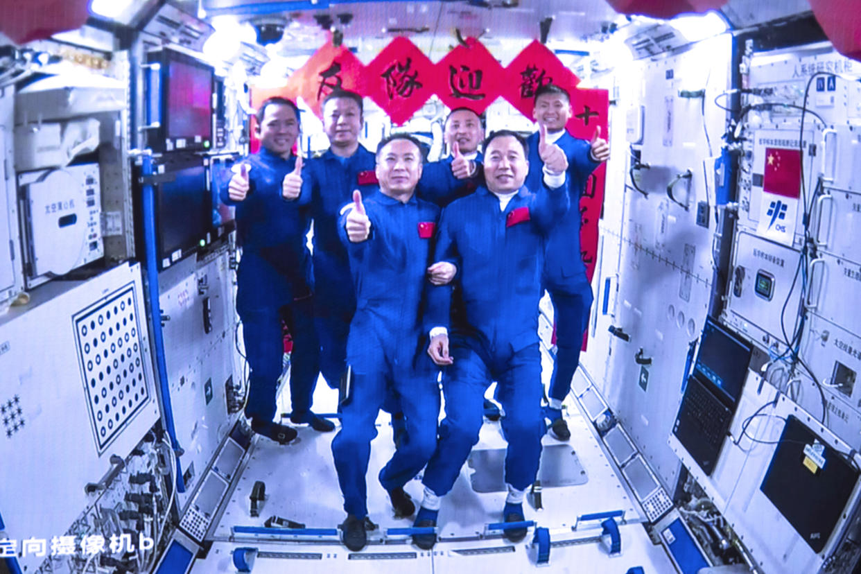 The crews of Shenzhou-15 and Shenzhou-16 inside China's space station