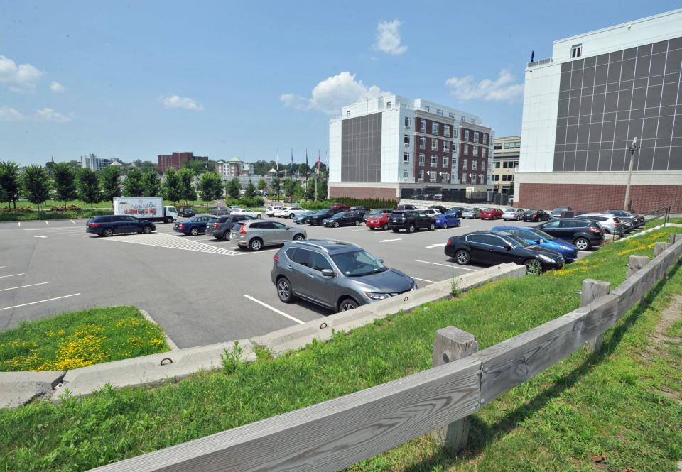 The city plans to build a performing arts center on this parking lot at Hancock Street and Walter Hannon Parkway in Quincy, shown on Wednesday, July 12, 2023.