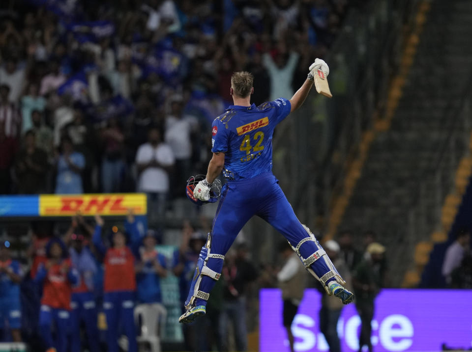 Mumbai Indians' Cameron Green, who scored hundred celebrates after winning the Indian Premier League (IPL) cricket match between Mumbai Indians and Sunrisers Hyderabad in Mumbai, India, Sunday, May 21, 2023.(AP Photo/Rajanish Kakade)