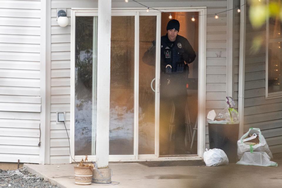 Officers investigate a homicide at an apartment complex south of the University of Idaho campus on Sunday, Nov. 13, 2022. Four people were found dead on King Road near the campus, according to a city of Moscow news release issued Sunday afternoon. (Zach Wilkinson/Moscow-Pullman Daily News via AP)