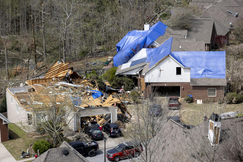 Damage is seen to residences at the Eagle Point subdivision following a day of extended severe weather, Friday, March 26, 2021, in Birmingham, Ala. (AP Photo/Vasha Hunt)