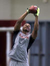 Wide receiver Amari Cooper (9) catches a pass at Alabama's Pro Day, Wednesday, March 11, 2015, in Tuscaloosa, Ala. The event is to showcase players for the upcoming NFL football draft. (AP Photo/Butch Dill)