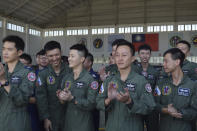 Taiwanese airmen applaud as they listen to Taiwan President Tsai Ing-wen speak during her visit to the Penghu Magong military air base in outlying Penghu Island, Taiwan Tuesday, Sept. 22, 2020. Tsai visited the military base on one of Taiwan’s outlying islands Tuesday in a display of resolve following a recent show of force by rival China. (AP Photo/Wu Huizhong)