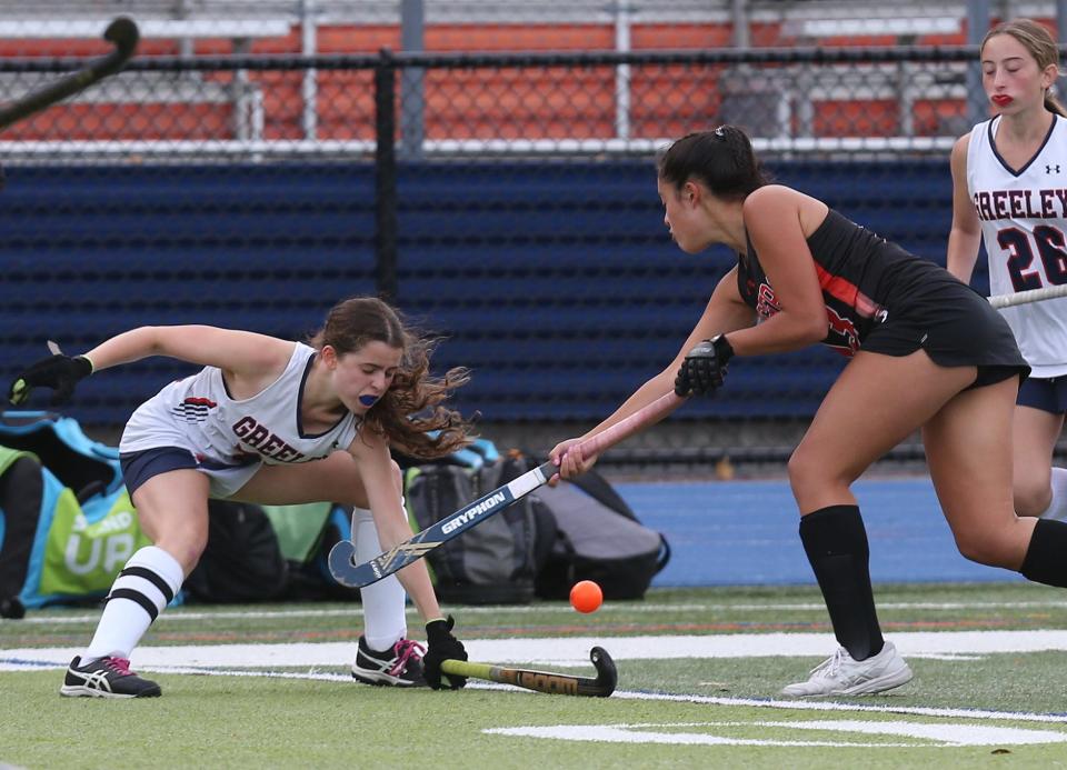 Horace Greeley's Dani Halperin tries to stop drive by Mamaroneck's Bella LaPorta during Greeley's 1-0 field hockey win at Horace Greeley High School in Chappaqua Oct. 12, 2022.