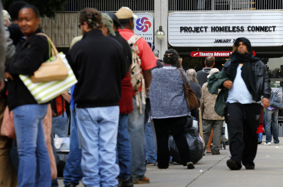 Homeless families and individuals line up to attend Project Homeless Connect in San Diego in 2015, a one-day resource fair. Local officials are trying to find ways to address an outbreak of hepatitis A. (Photo: Mike Blake / Reuters)