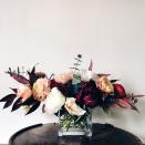 <p>If your taste isn’t exuberant red, green, and gold, turn to a more subdued palette with a centerpiece that features muted jewel tones and dark leaves. This quiet arrangement speaks volumes to your good taste. </p><p><em>Via <a href="http://www.bostonpollen.com/" rel="nofollow noopener" target="_blank" data-ylk="slk:Pollen;elm:context_link;itc:0;sec:content-canvas" class="link ">Pollen</a></em></p>