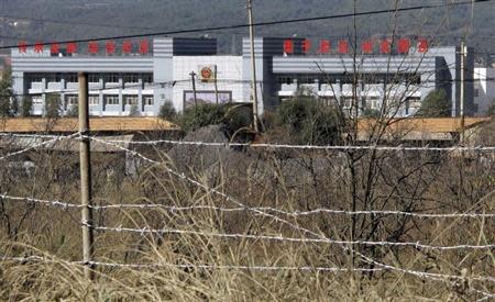 Iron wire fencing is seen outside a labour camp in Kunming, Yunnan province, November 22, 2013. REUTERS/John Ruwitch