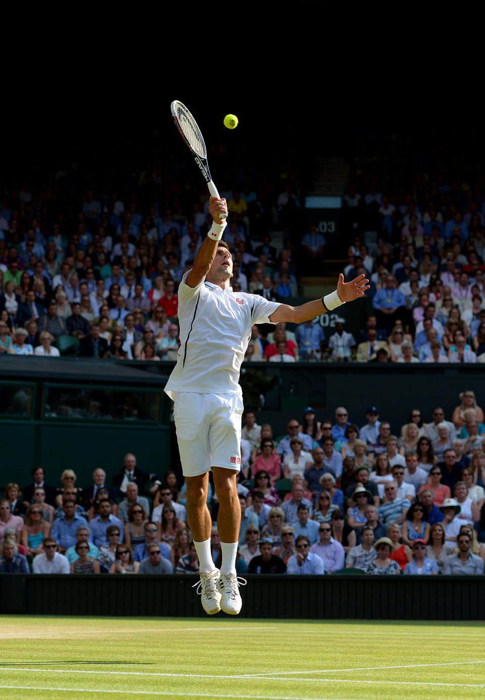 Serbia's Novak Djokovic in action against Argentina's Juan Martin Del Potro during day eleven of the Wimbledon Championships at The All England Lawn Tennis and Croquet Club, Wimbledon.