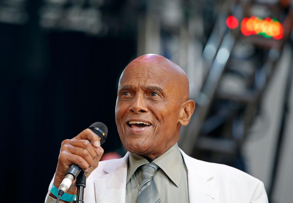Singer and activist Harry Belafonte speaks during a memorial tribute concert on July 20, 2014, for folk icon and civil rights activist Pete Seeger at Lincoln Center's Damrosch Park in New York.