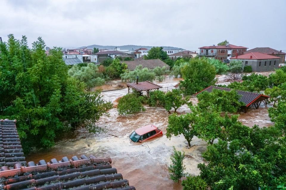 A car is submerged under water during a storm on mount Pelion, near Volos, Greece (via REUTERS)