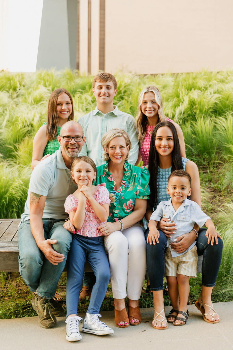 Jennifer McMillan, sitting center, is surrounded by her family. Her husband, Tony McMillan, and bonus daughter, Lillian McMillan, are sitting on the left. Daughter Peyton Washington and grandson Weston Blackburn are sitting on the right. Back row, from left to right, includes daughter Maggie Washington, son Thomas Washington and daughter Olivia Washington.  (Courtesy Emily Hart Photography)