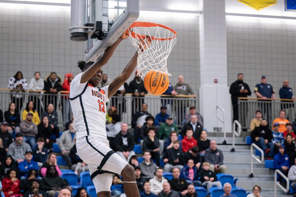 North's Joe Okla dunks the ball to extend the Polar Bears' lead to 10 points over Leominster with two minutes left.