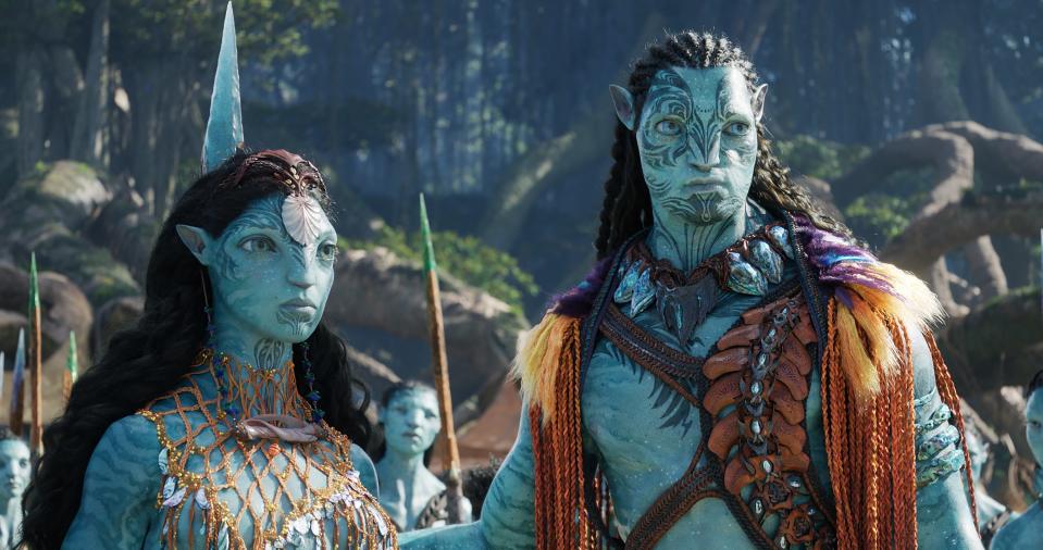 Ronal (left, played by Kate Winslet) and Tonowari (Cliff Curtis) during the filming of "Avatar: The Way of Water." While their images look entirely computer generated, the images are based on movements made by the human actors while wearing special suits.