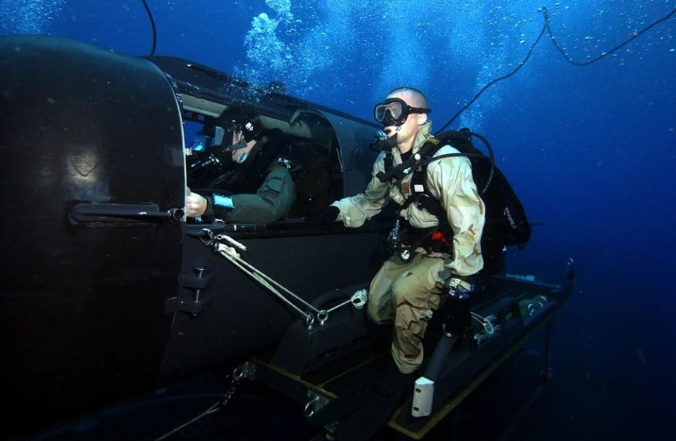 Navy diver and special operator from SEAL Delivery Team 2 perform SDV operations