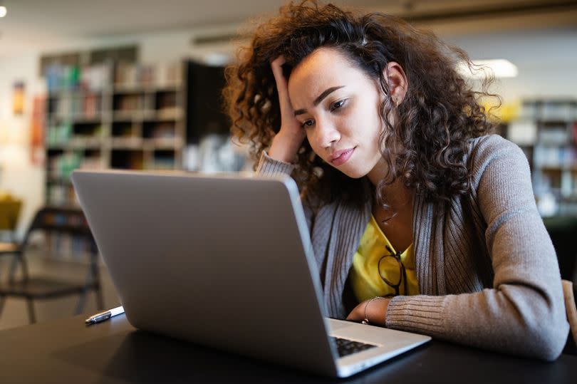 Student girl finding it difficult at study and comprehend scool tasks