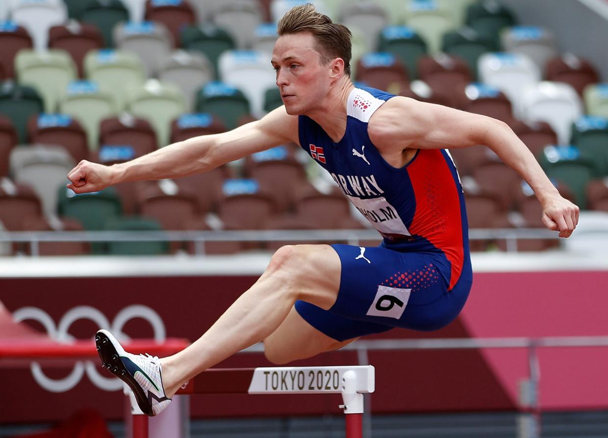 Karsten Warholm hurdling at the Tokyo Olympics.