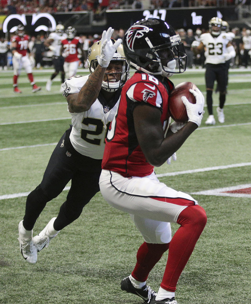 Atlanta Falcons wide receiver Calvin Ridley catches a touchdown pass past New Orleans Saints cornerback P.J. Williams during the first quarter of an NFL football game Sunday, Sept 23, 2018, in Atlanta. (Curtis Compton/Atlanta Journal-Constitution via AP)