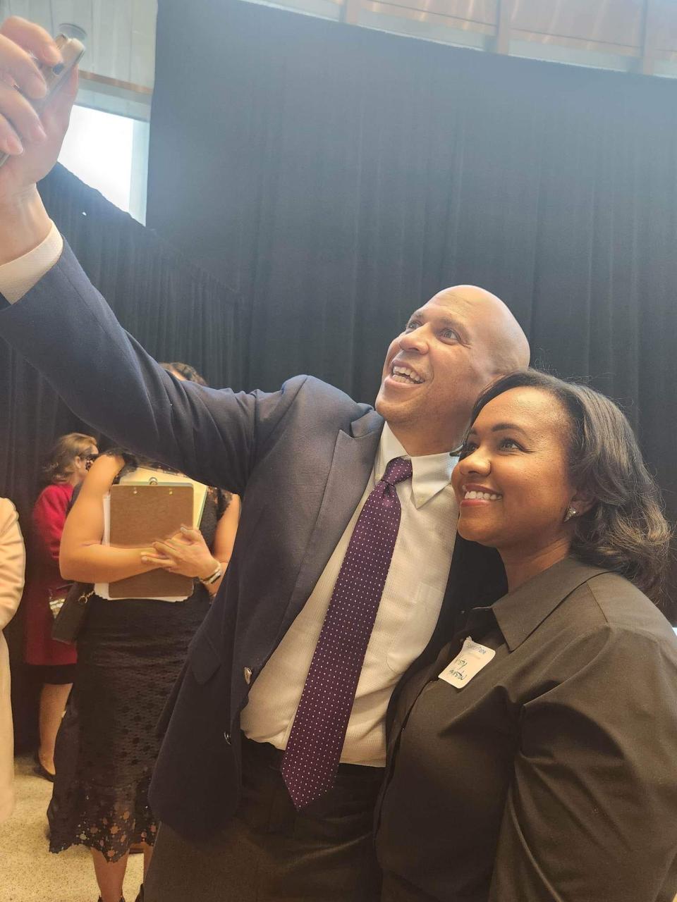 Senator Corey Booker (D-New Jersey) takes a selfie with Kristy Hairston at the 22nd annual Martin Luther King Jr. Breakfast.